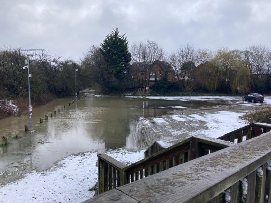 Water flooding from the River Welland into car park opposite Market Harborough station